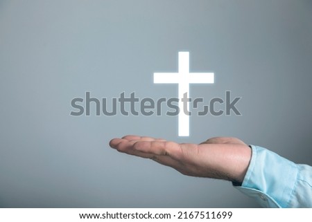Christian cross icon. Man holding in his hand