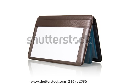 Leather tag and notebook setting on table isolated with white background.