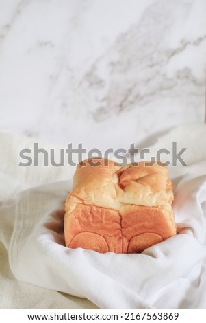 Homemade Fresh-baked homemade Hokkaido milk bread for Breakfast. Cooking at home. Selective focus. Bakery Concept Picture. Copy Space for Text
