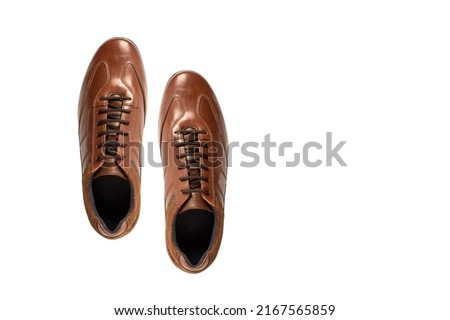 Brown leather shoes isolated on white background. Top view
