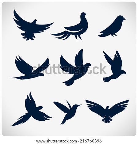 Set of flying birds sign. Dark silhouettes isolated on white.