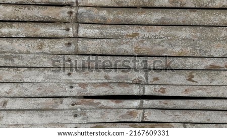 abstract detail background of an old bamboo wall in urban area. 