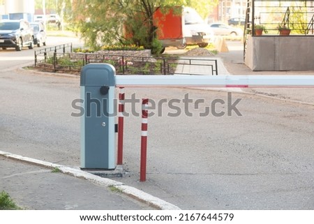 A barrier for parking a car. Automatically the barrier for the entry of the car.