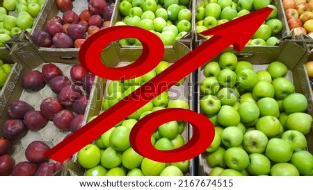 Red 3d Percent sign with grow up arrow on fruits, green and red apples background. Retail industry. Farmers market. Discount. Rising food prices. Grocery store. products. Local suppliers. Inflation.