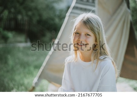 Cheerful beautiful girl on a sunny day