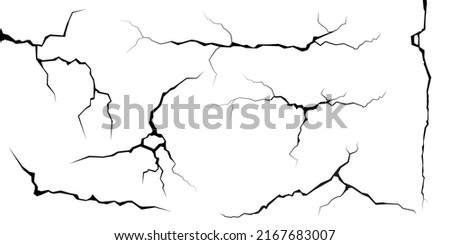 Surface cracks and fissures in ground, concrete, crevices from disaster top view. Breaks on land surface from earthquake isolated on white background. Broken ground, wall, glass pattern effect. Damage Royalty-Free Stock Photo #2167683007