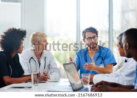 Sharing medical expertise for the best possible outcome. Shot of a team of doctors having a meeting in a hospital.