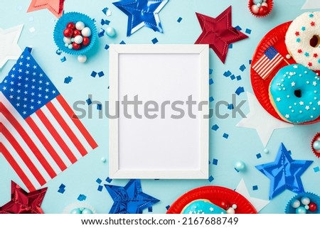 USA Independence Day concept. Top view photo of photo frame national flags stars confetti paper backing molds with candies plates with glazed donuts on isolated pastel blue background with empty space