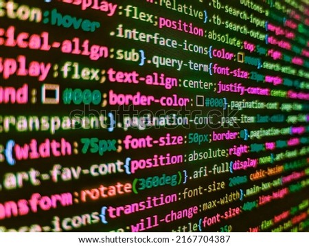 Python programming developer code. HTML CSS3 source code on lcd screen with black background. Database bits access stream visualisation. Programming code abstract screen of software developer