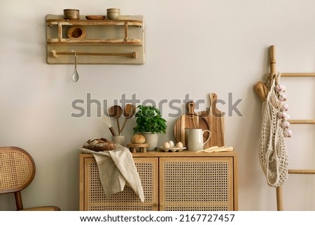 Interior design of kitchen space with rattan commode,  ladder, herbs, vegetables, food and kitchen accessories in modern home decor.  Template. 