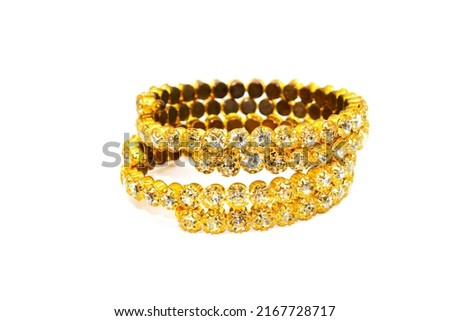 A picture of gold plated diamond bracelets with selective focus