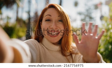 Young redhead woman smiling confident make selfie by the camera at park