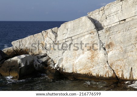 Aegean seashore and marble rocks in Aliki, Thassos island, Greece 