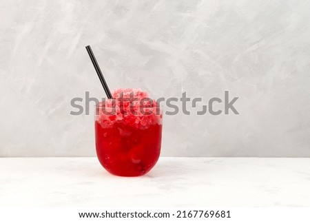 Red Slushie. Sweet Shaved ice. Spanish fruit granizado drink. Refreshing summer iced drink. Royalty-Free Stock Photo #2167769681