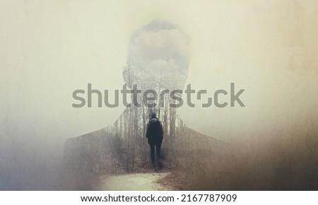 The soul seeks its own path. Composite image of a mans silhouette superimposed on a woman alone in the woods. Royalty-Free Stock Photo #2167787909