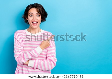 Photo of young funky excited cheerful woman advertising product on black friday sale isolated on blue color background