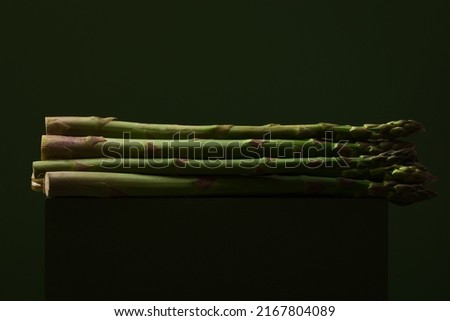green asparagus on a green background
