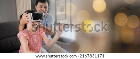 Happy family father and daughter playing VR glasses on couch at home, Image panorama for cover design, GameFi.