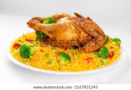 Whole Grilled Chicken (Chargha) serve with vegetables and rice. Royalty-Free Stock Photo #2167831243