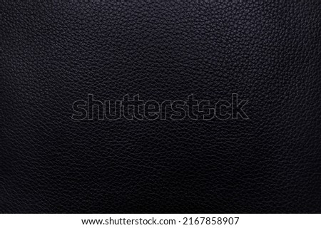 Leatherette surface for a textured background with a blue tint. Blue leather textured