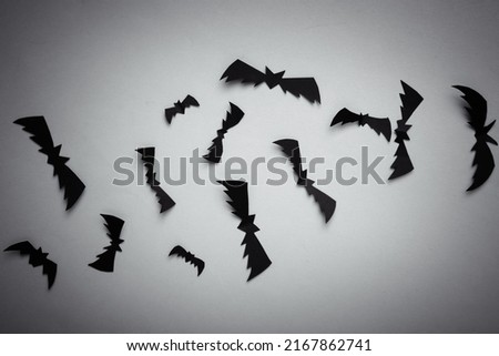Paper-cut black bats on a black background. Halloween, Horror, creepy background