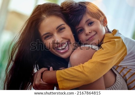 Mom, the best friend a boy could ever have. Shot of an adorable little boy affectionately hugging his mother at home.