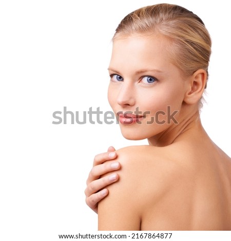 Taking time out for beauty. Studio shot of a gorgeous young blond woman. Royalty-Free Stock Photo #2167864877