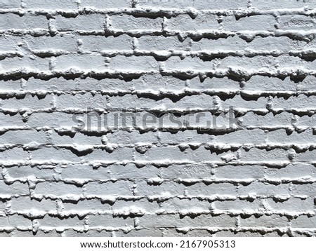 a vintage old white painted alley cinder block brick wall building exterior shadows retro style