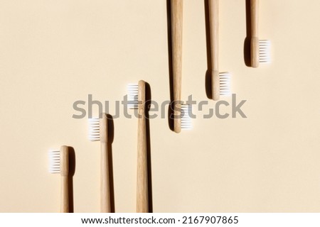 Bamboo toothbrushes on light background. Say no to plastic concept. Top view, copy space, flatlay.