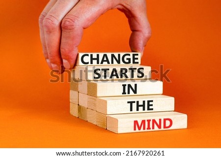 Change starts in the mind symbol. Concept words Change starts in the mind on wooden blocks on a beautiful orange table orange background. Business motivational and change starts in the mind concept.