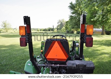 Caution sign and lights on a tractor