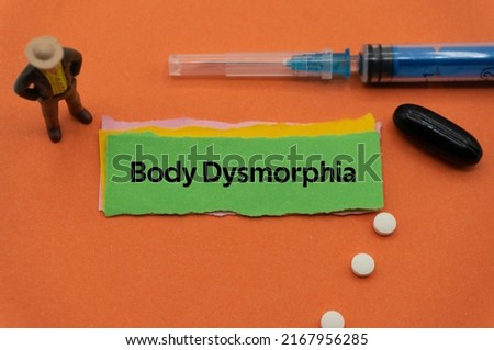 Body Dysmorphia.The word is written on a slip of colored paper. health terms, health care words, medical terminology. wellness Buzzwords. disease acronyms. Royalty-Free Stock Photo #2167956285