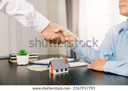 Real estate brokers or real estate agent with client or architect team Discussions about contracts , Saving money to invest in house or property in the future. Business property Concept.