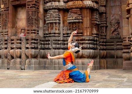 Indian Dancer posing at temple. Odissi dance form. Dance of India Royalty-Free Stock Photo #2167970999