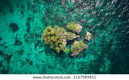 Somewhere unknown lies something beautiful. High angle shot of the beautiful islands of Indonesia.