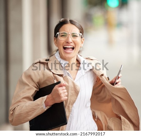 Everything chooses the same day to go south. Portrait of a young woman looking panicked and rushed while trying to catch a cab outside. Royalty-Free Stock Photo #2167992017