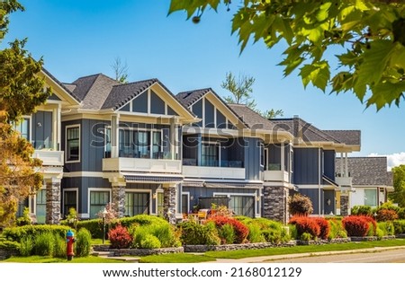 Neighborhood modern houses building in BC, Canada. Canadian modern residential architecture, low-rise-Vancouver BC, Canada. Nobody, street photo Royalty-Free Stock Photo #2168012129