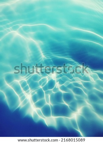 Closeup abstract of surface blue water for background. Blurred abstract for background. Top​ view​ of water splash for background. Reflection on surface blue water in the sea. Reflection​ of​ water.