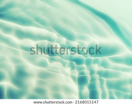 Closeup abstract of surface blue water for background. Blurred abstract for background. Top​ view​ of water splash for background. Reflection on surface blue water in the sea. Reflection​ of​ water.