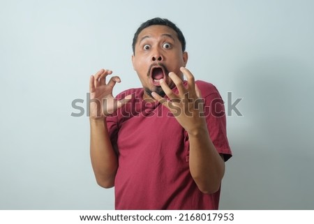 funny shocked reaction of man looking on something Royalty-Free Stock Photo #2168017953