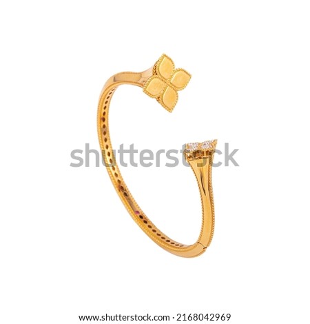 Gold, silver, metal bracelet on black background. Women's accessory.