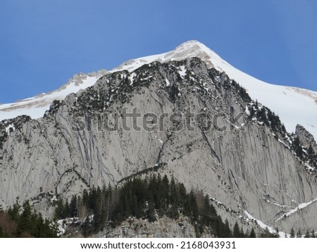 Snow-capped alpine rock Schofbergwand on the south side of the peak Wildhuser Schofberg in Alpstein mountain range and in Appenzell Alps massif, Wildhaus - Canton of St. Gallen, Switzerland (Schweiz)