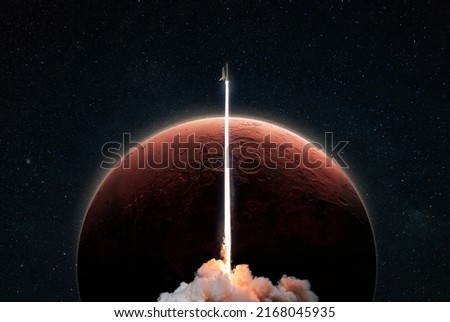 New space shuttle rocket with a blast takes off into space against the background of the red planet Mars and explores space. Concept of technology and travel to other planets. Spaceship lift off  Royalty-Free Stock Photo #2168045935