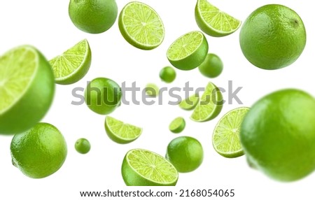 Flying lime fruits, isolated on white background Royalty-Free Stock Photo #2168054065