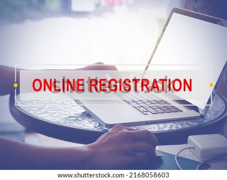 Hand Typing on keyboard with text ONLINE REGISTRATION. Business and online marketing or ecommerce concept.