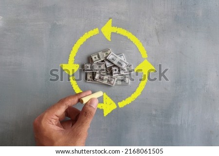 Money and hand draw circular arrows. Cashback, cash flow concept. Royalty-Free Stock Photo #2168061505