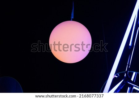 Colorful neon light with lamp at club or bar night.