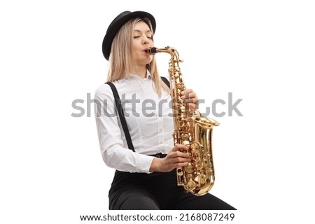 Young blond female playing a saxophone isolated on white background Royalty-Free Stock Photo #2168087249