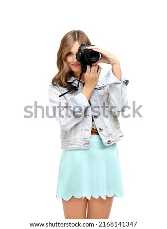 Shot of an funny young girl taking a photo with a  camera