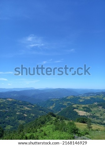 Spectacular views of lush green mountains, blue skies and clouds